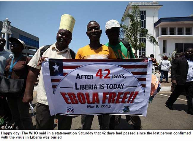 Men celebrating that Liberia is Ebola free