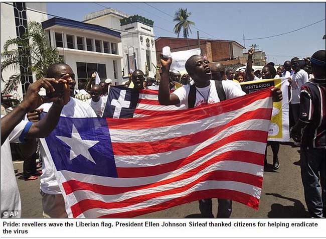 Reveller wave the Liberia Flag