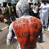 Liberian man with Ebola sign on his back
